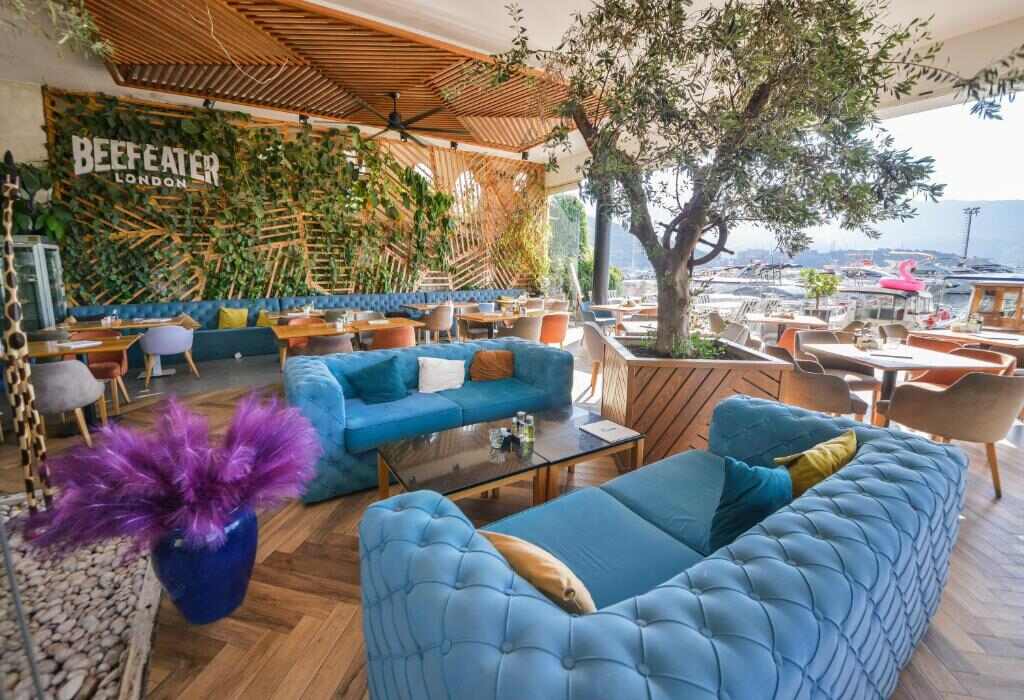 Riva restaurant lounge with blue sofas by the marina
